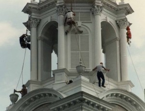 Steeplejacks restoring a historic church steeple