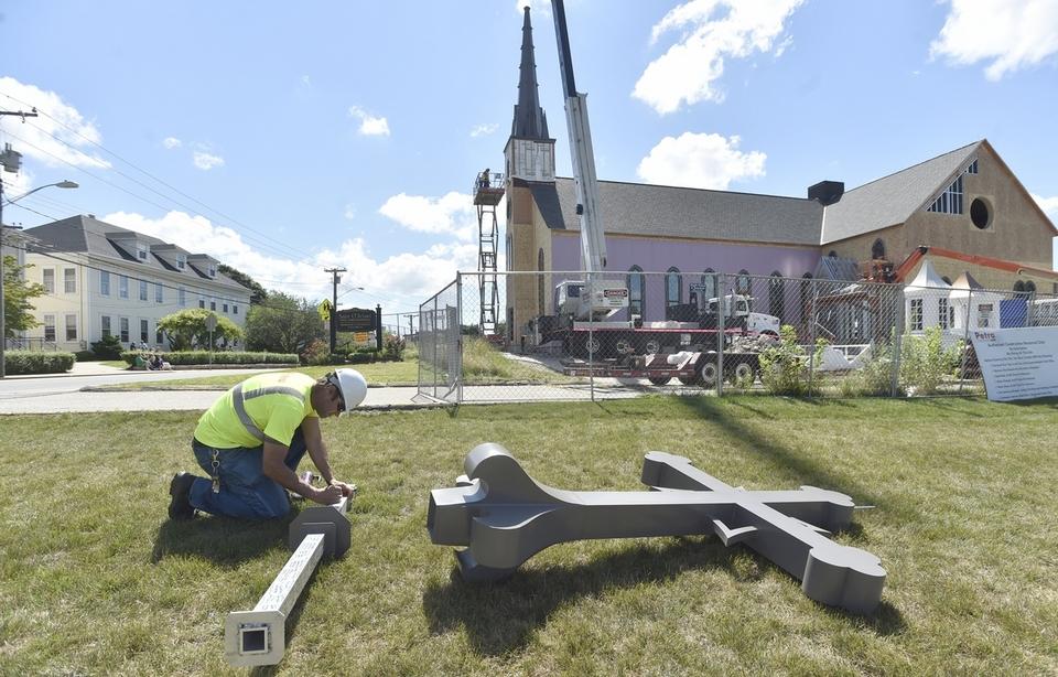 Rebuilding of St. Michael Church hits milestone with placing of Steeple & Cross